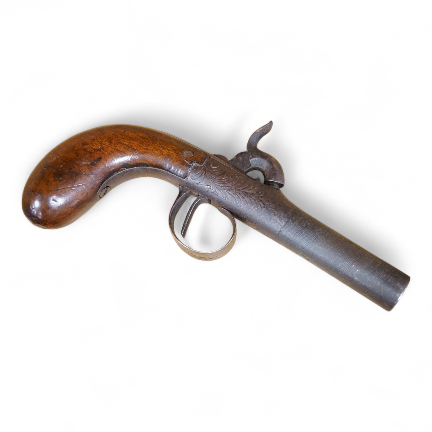 A boxlock percussion pocket pistol with turn off barrel etched with ribbon twist, engraved rounded frame, liege proved, with rounded walnut butt